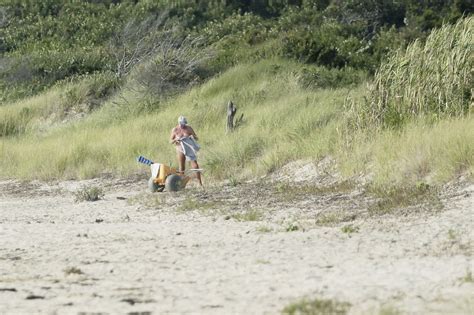 nude guys at beach|Voyeur is secretly filming naked guys at the nudist beach.